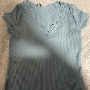 i am selling this beautiful blue, medium sized, women’s blouse